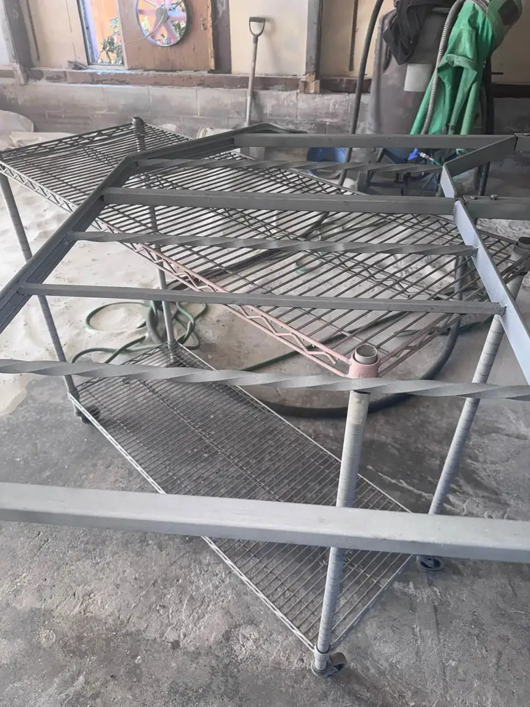 The same steel rack frame after sandblasting at our Carlisle shop, clean gray metal