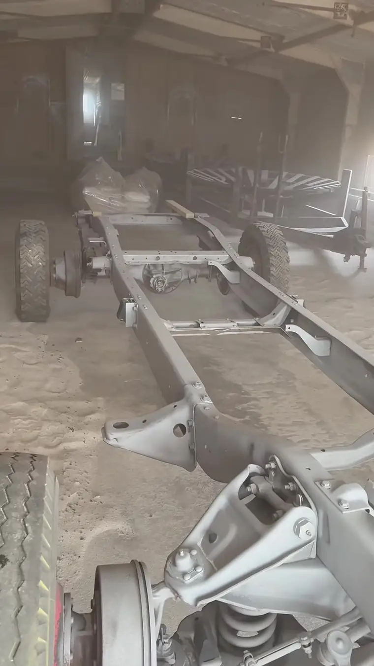 Pickup truck frame sandblasted to bare steel in the shop